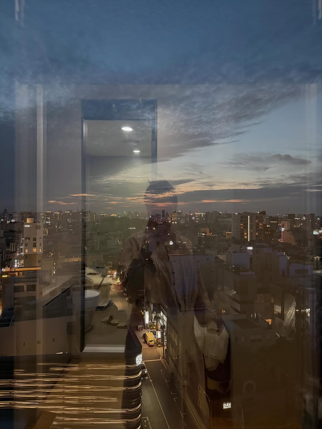 Photo by 지윤미 on October 25, 2025. May be an image of mirror, skyscraper, twilight, window, buildings and text.