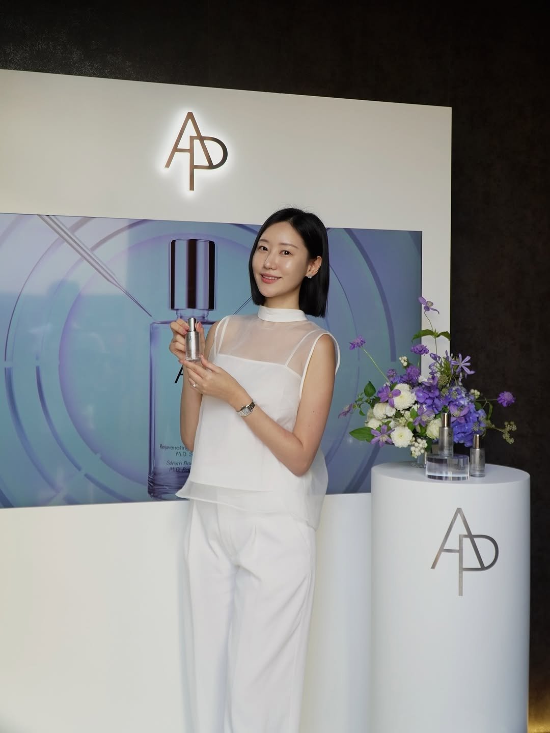 Photo shared by 오늘의 윤세 on September 24, 2025 tagging @ap_beauty_official. May be an image of 1 person, makeup, jumpsuit, microphone and text.