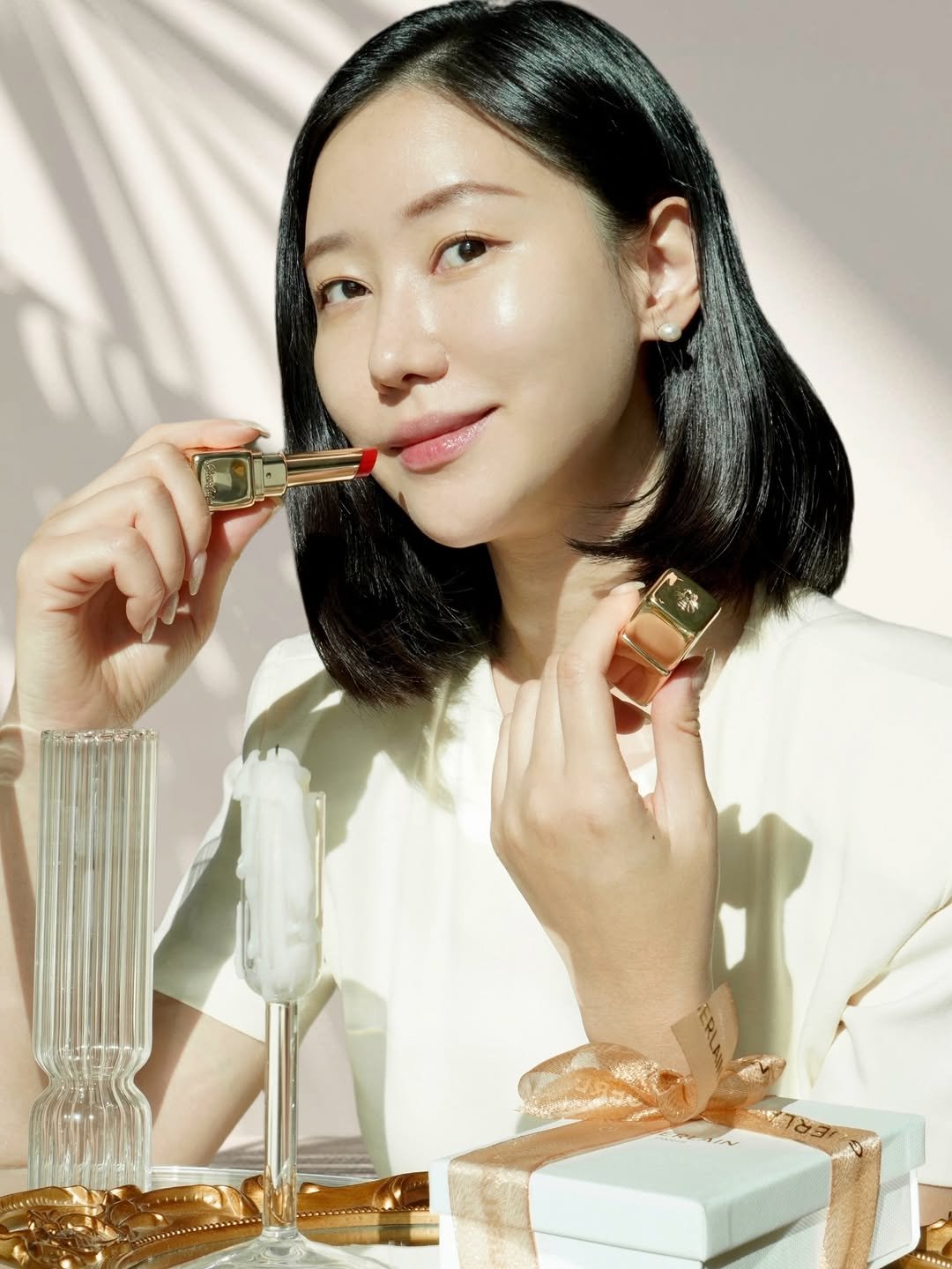 Photo shared by 오늘의 윤세 on December 22, 2025 tagging @guerlain. May be an image of one or more people, makeup, lipstick, fragrance, perfume, hand cream, cosmetics and text.