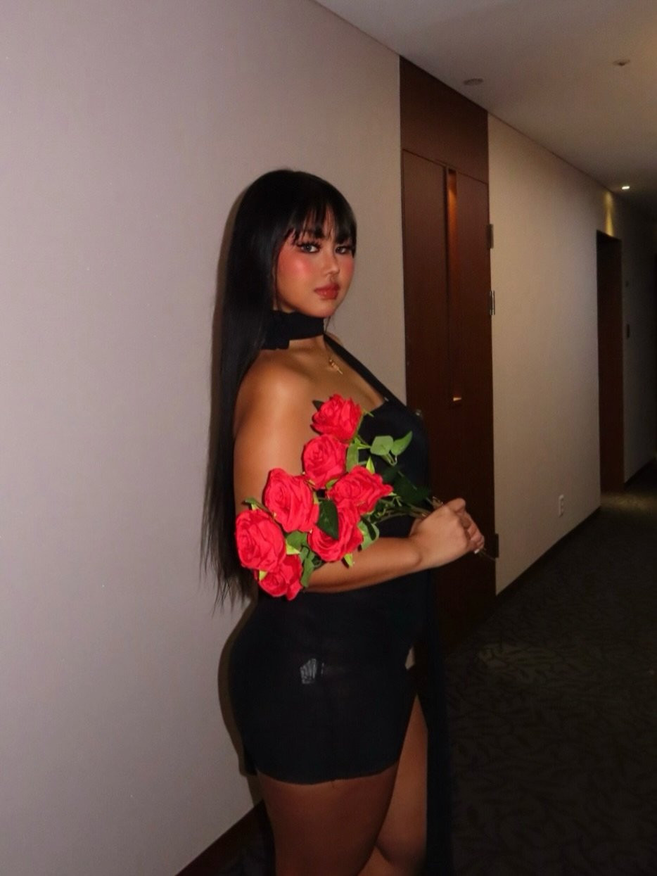 Photo by Grace Yoon on February 17, 2026. May be an image of one or more people, long hair, miniskirt, rose and text.