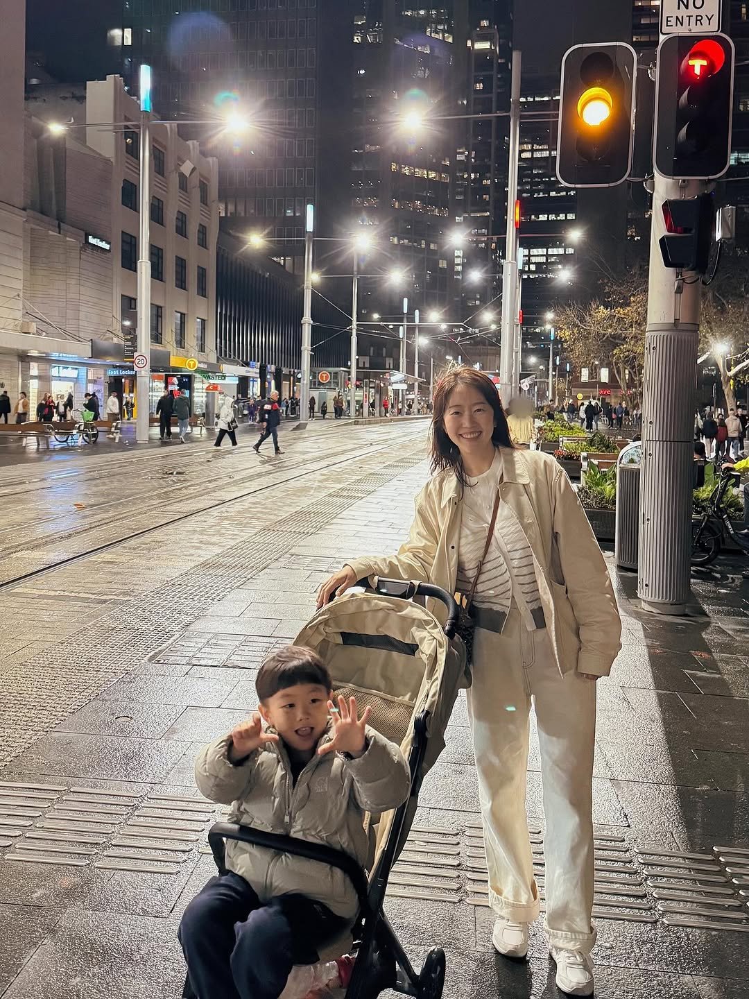 Photo by 유트루 on August 02, 2025. May be an image of 8 people, child, bicycle, segway, scooter, umbrella, carriage, wheelchair, street and text.