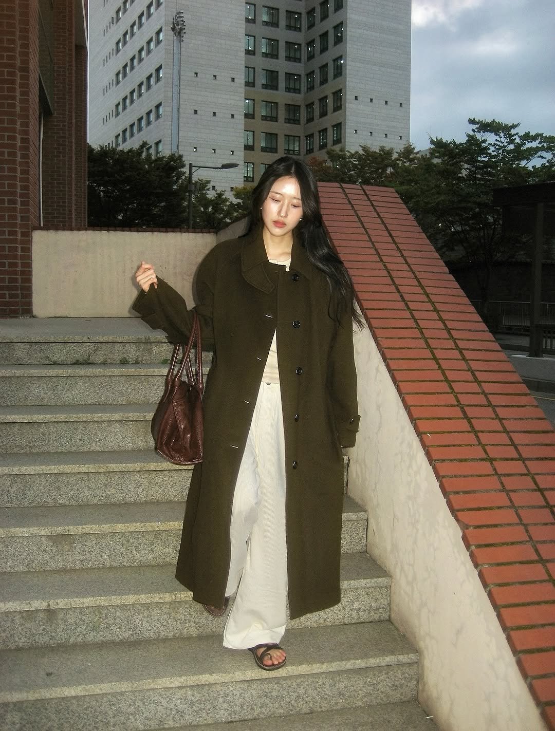 Photo by 조유영 on October 30, 2025. May be an image of overcoat, duffle coat, parka and text.