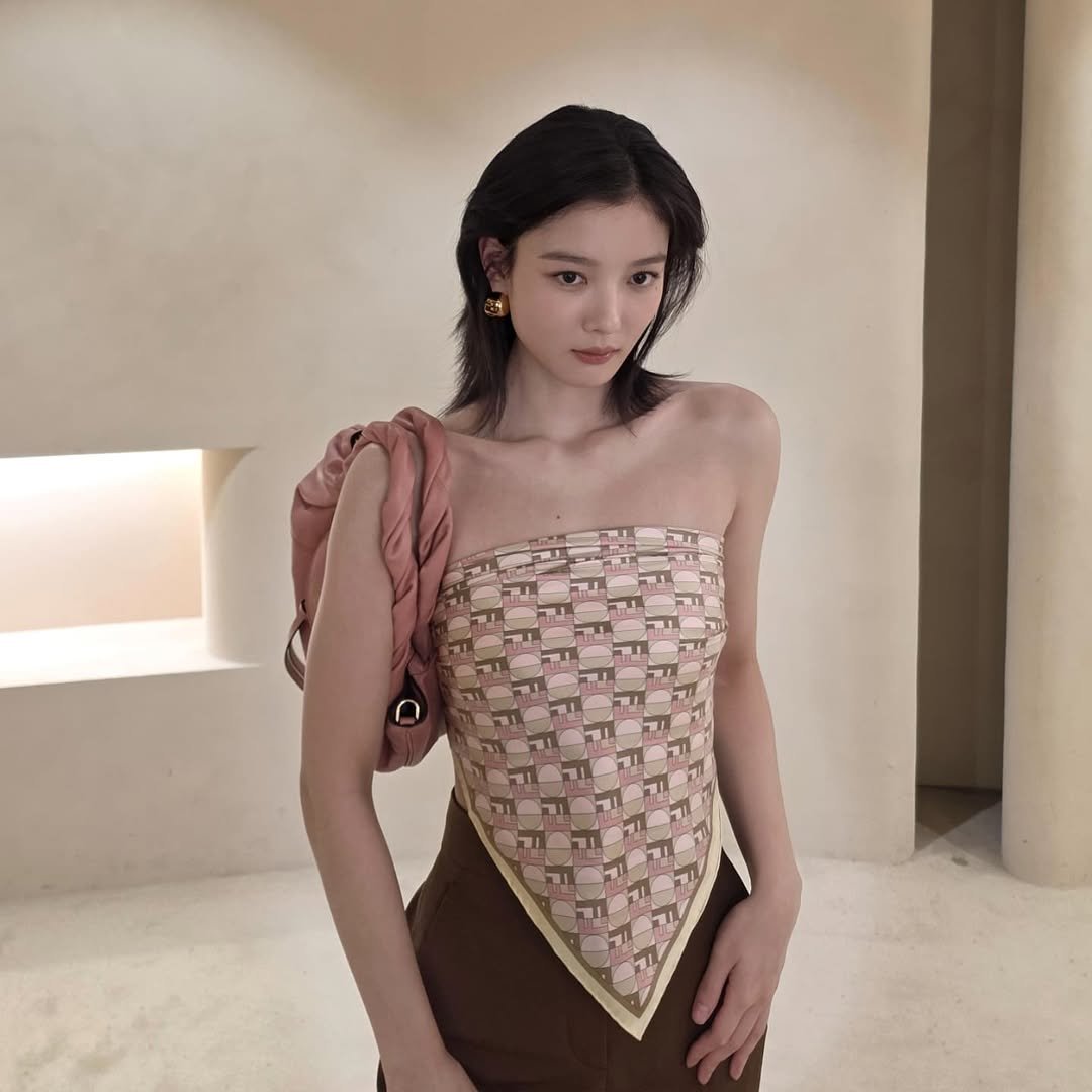 Photo shared by 김유정  KIM YOU JUNG 🇰🇷 on July 13, 2025 tagging @fendi. May be an image of one or more people, hair, top and dress.
