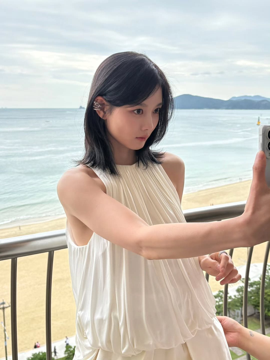 Photo by 김유정  KIM YOU JUNG 🇰🇷 on September 22, 2025. May be an image of 1 person, hair, sleepwear, sundress, dress and text.