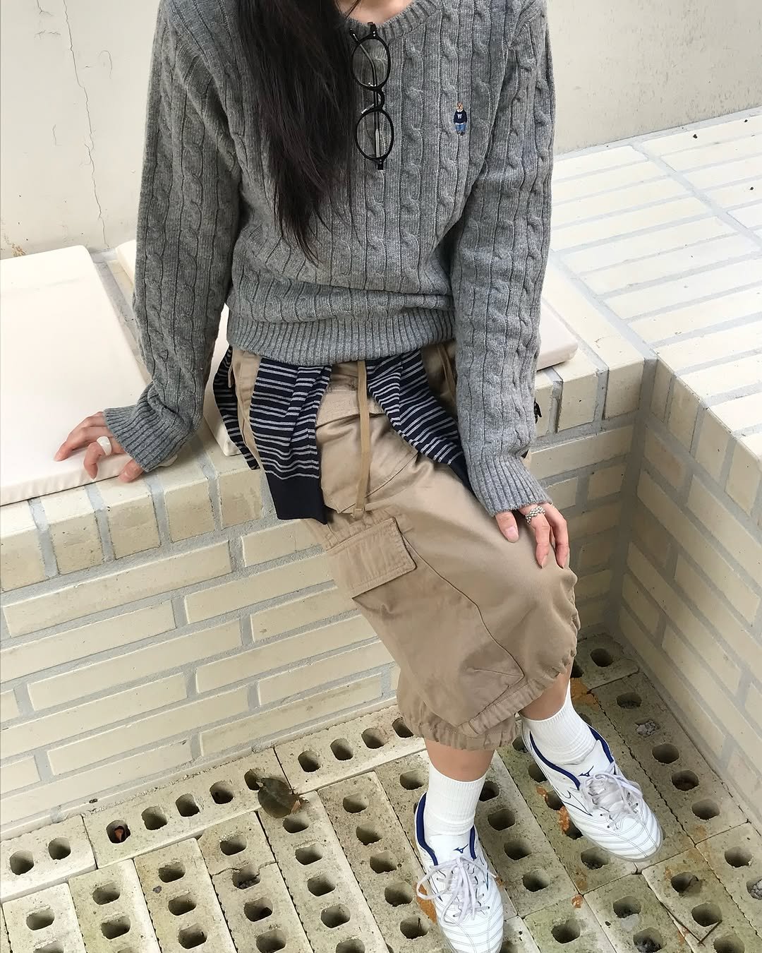 Photo shared by 유빈 on September 17, 2025 tagging @whoaukorea, and @whoau_ootd. May be an image of wingtip shoes, sweater, sweatpants and bandanna.