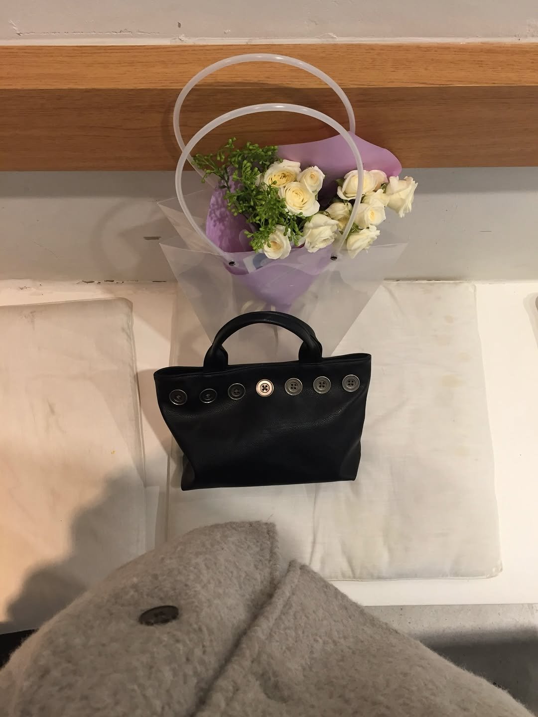 Photo shared by 유빈 on December 25, 2025 tagging @yangyuncheor. May be an image of purse, prairie gentian, baby's-breath, white lily and text.