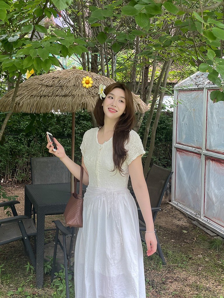 Photo by 유나브 • 윰🍡 on August 07, 2025. May be an image of 1 person, dress, sundress, parasol, white lily, baby's-breath, outdoors and text.