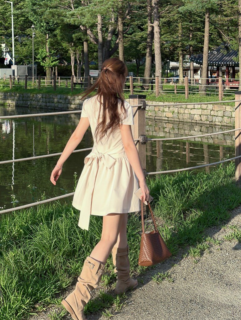 Photo by 유나브 • 윰🍡 on July 30, 2025. May be an image of 1 person, boots, lake and text.