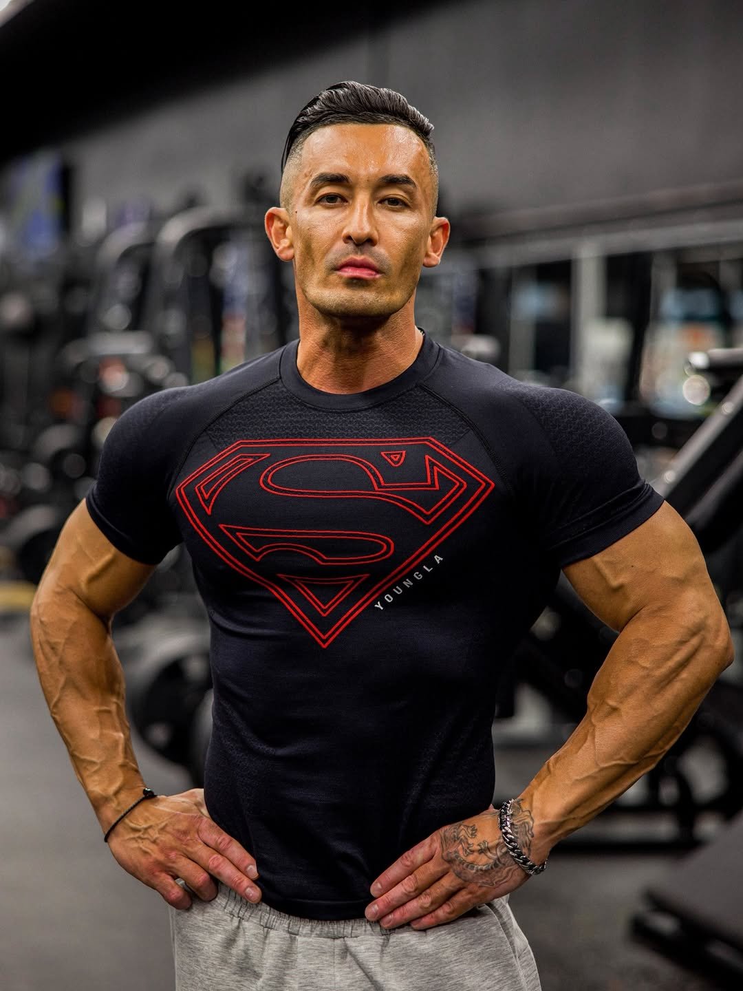 Photo shared by YoungLA on February 13, 2026 tagging @lex.tarasov. May be an image of one or more people, biceps, people bodybuilding, Superman, activewear, sportswear and text.