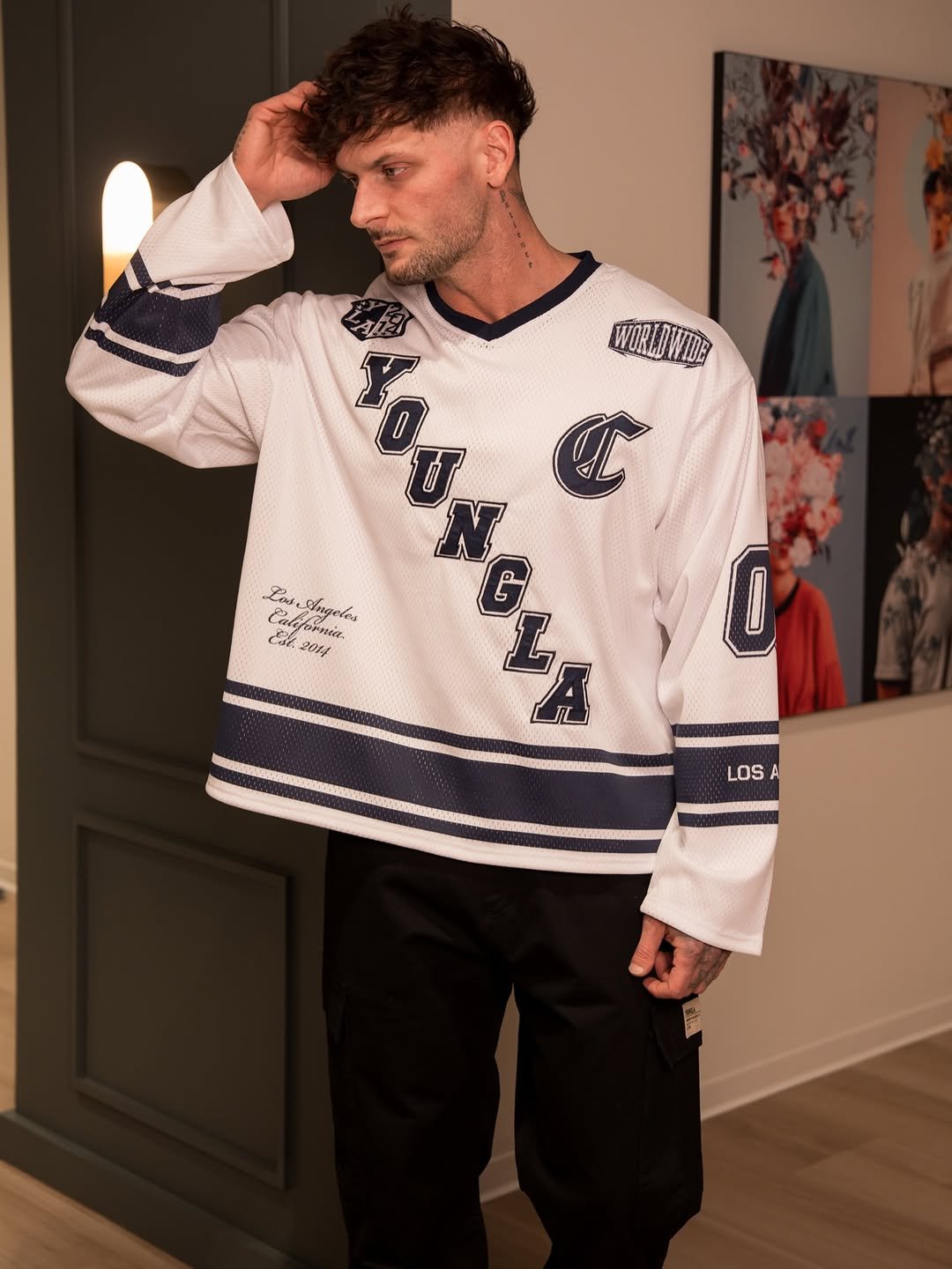 Photo shared by YoungLA on December 09, 2025 tagging @jerdani._. May be an image of sweater, fleece, sportswear, cardigan, turtleneck, sweatshirt and text.