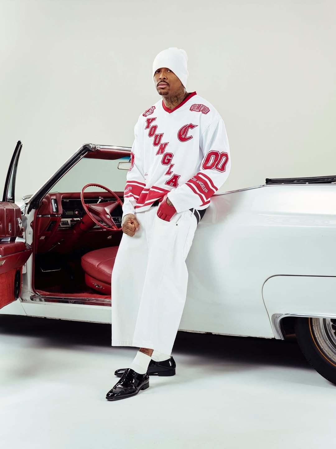 Photo shared by YoungLA on December 08, 2025 tagging @yg. May be an image of sportswear, sweatpants, sweatsuit, headscarf, beret and text.