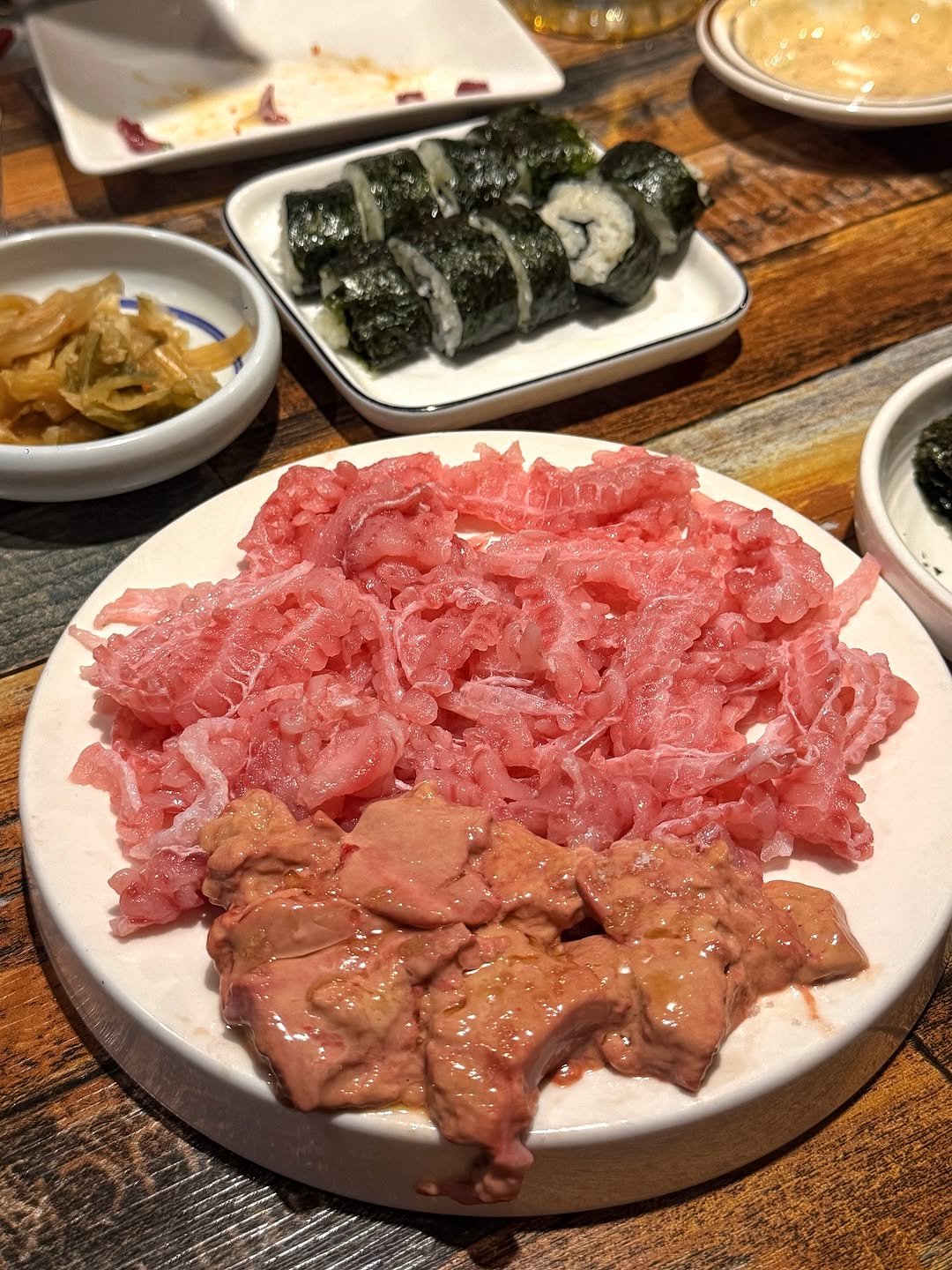 Photo by 하또먹 on October 14, 2025. May be an image of sashimi, sushi, pork and text.