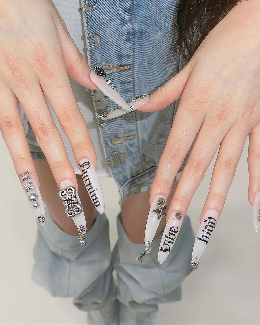 Photo shared by SeungHwi Yu on October 15, 2025 tagging @hwisnails, and @meovv. May be an image of one or more people, fingernails and text.