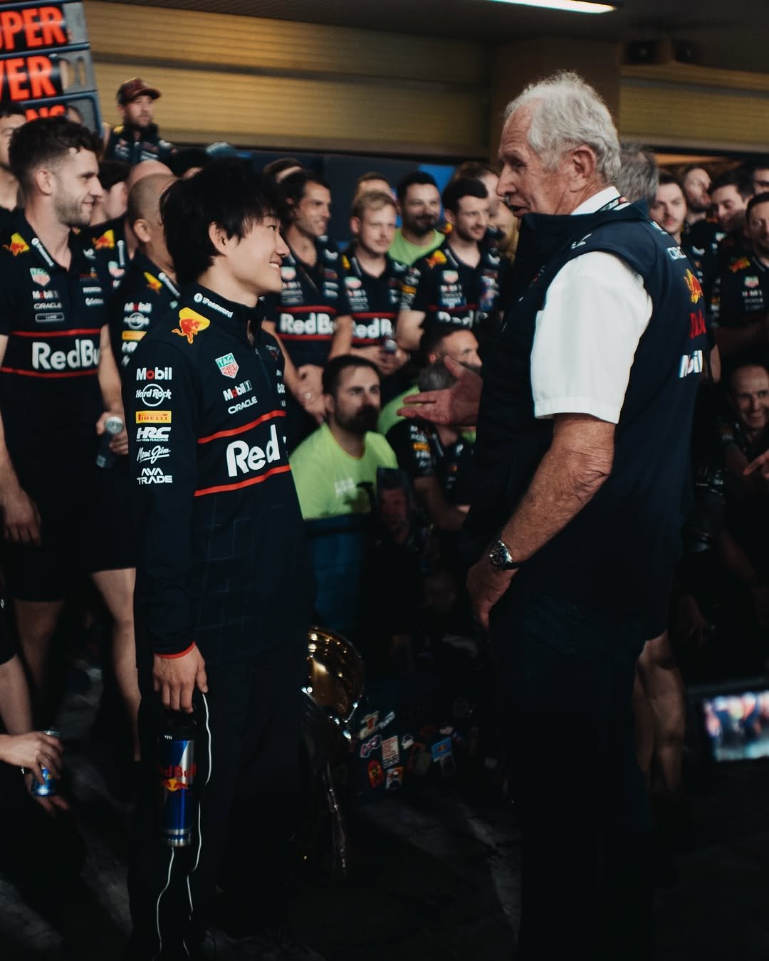 Photo by Yuki Tsunoda on December 10, 2025. May be an image of one or more people, people racing vehicles, race car, crowd and text.