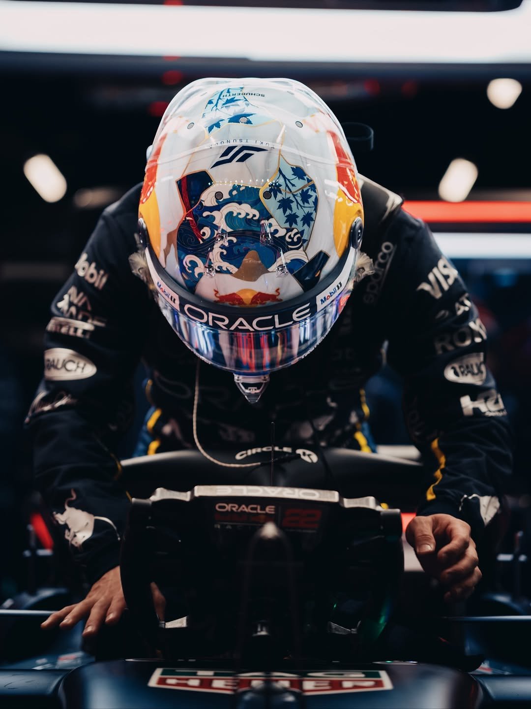 Photo by Yuki Tsunoda on November 22, 2025. May be an image of racing vehicles, race car and helmet.