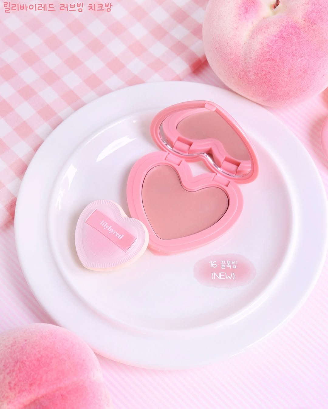 Photo shared by 율리아 𝗬𝗨𝗟𝗜𝗔 on January 26, 2026 tagging @lilybyred_official. May be an image of one or more people, makeup, heart, cosmetics and text that says '릴리바이레드 러브빔 치크밤 lilvbred lilybyred red ilvb 16꿀복밤 16 (NEW) (NEW)'.