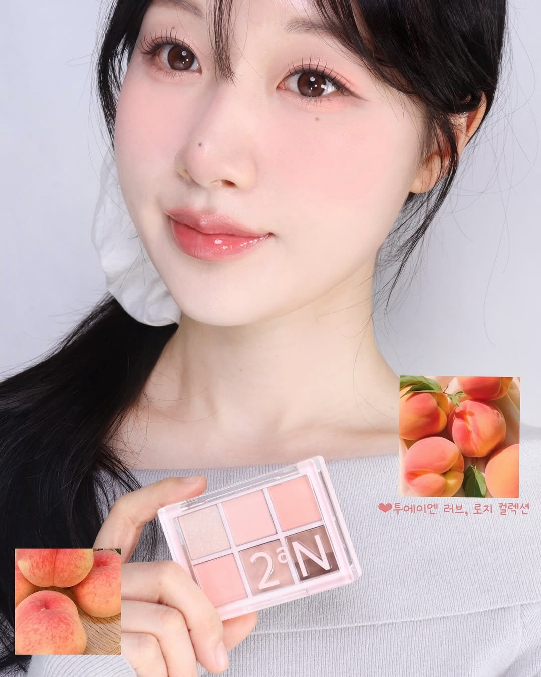 Photo shared by 율리아 𝗬𝗨𝗟𝗜𝗔 on April 08, 2026 tagging @2an_official. May be an image of one or more people, makeup and text that says '투에이엔 두에이엔러브,로지컬럭션 투에이엔 러브, 로지 컬렉션 2N N'.