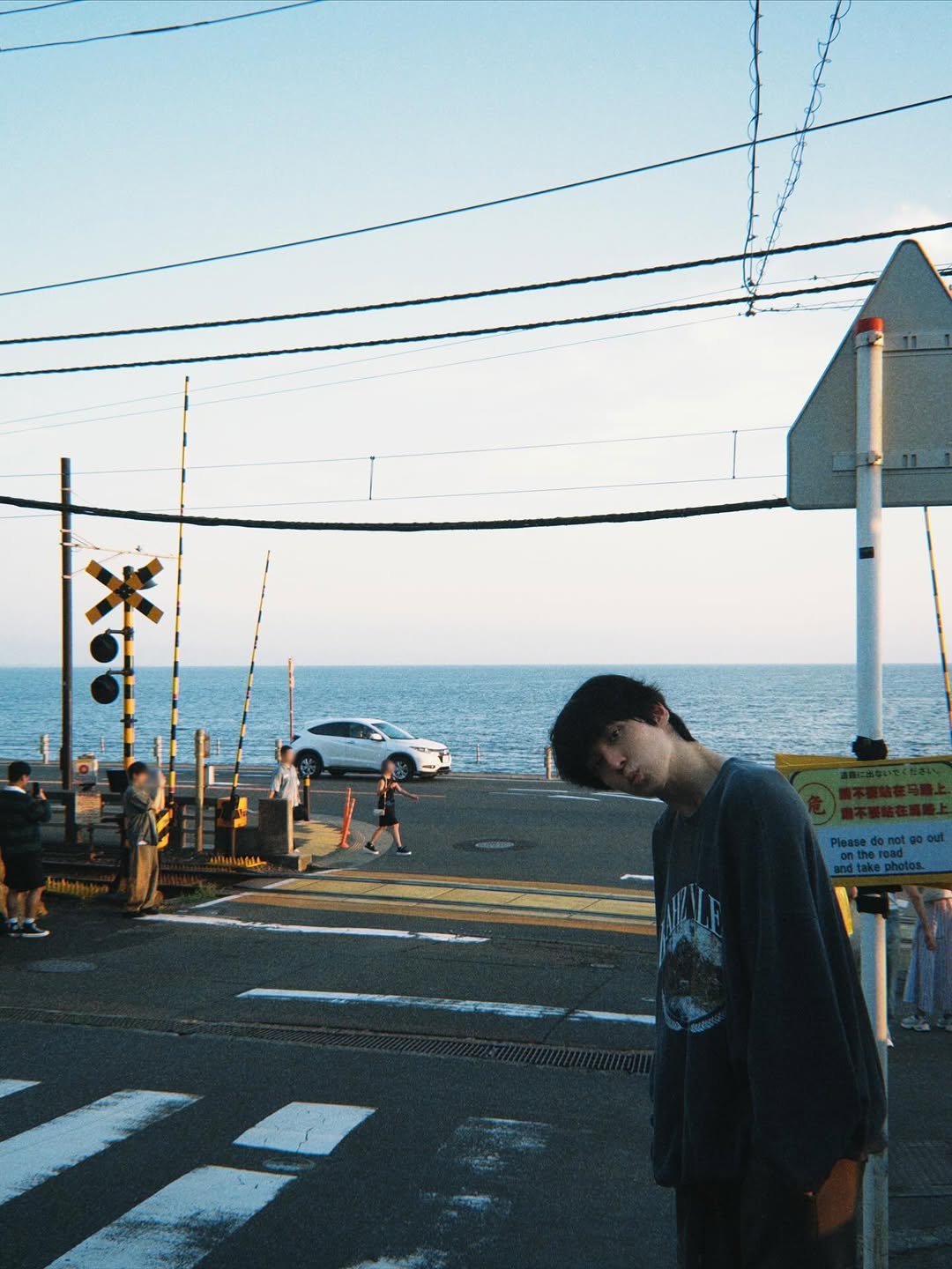 Photo by 윤호 (YUNHO) on September 20, 2025. May be an image of duffle coat, skateboard, street and telephone pole.