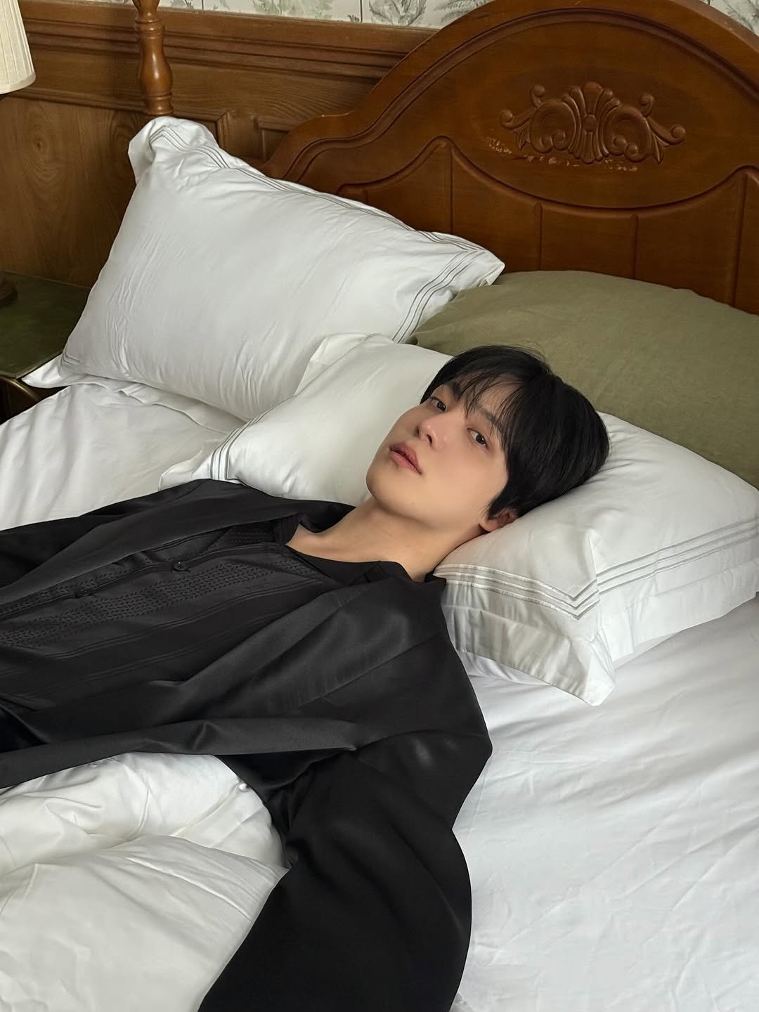 Photo by 윤호 (YUNHO) on October 18, 2025. May be an image of sleepwear, bed, bath robe, robe, mattress, bedroom and text.