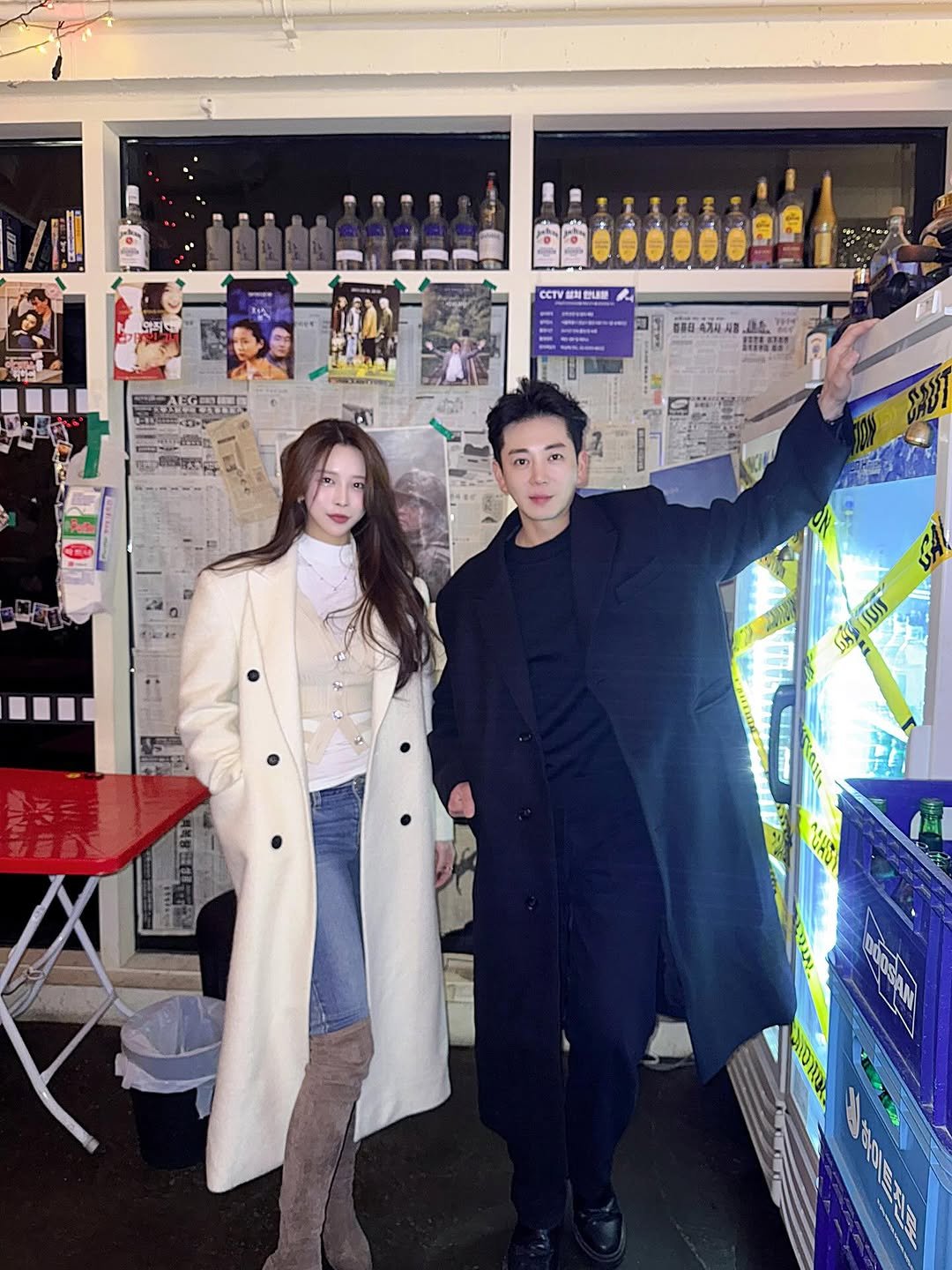 Photo shared by 이윤우 on January 28, 2026 tagging @ac_hyuck. May be an image of one or more people, people standing, duffle coat, overcoat, turtleneck, parka, blazer, cornflower and text.