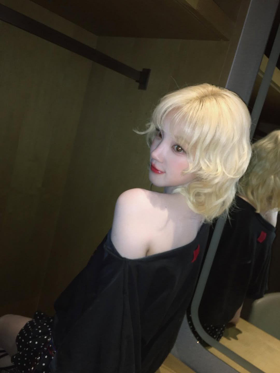 Photo by YUQI on July 14, 2025. May be an image of 1 person, blonde hair, makeup, costume and text.