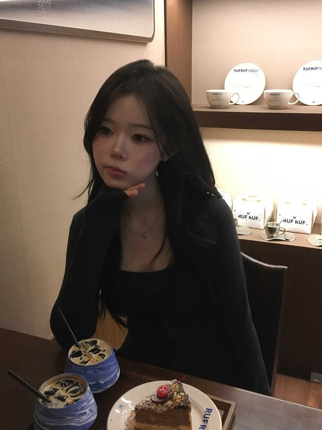 Photo by 홍유연 on December 10, 2025. May be an image of one or more people, hair, chocolate cake and text.