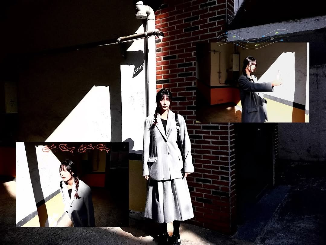 Photo by 하랑 on January 19, 2026. May be an image of duffle coat, overcoat, suit, brick wall, hallway and text.