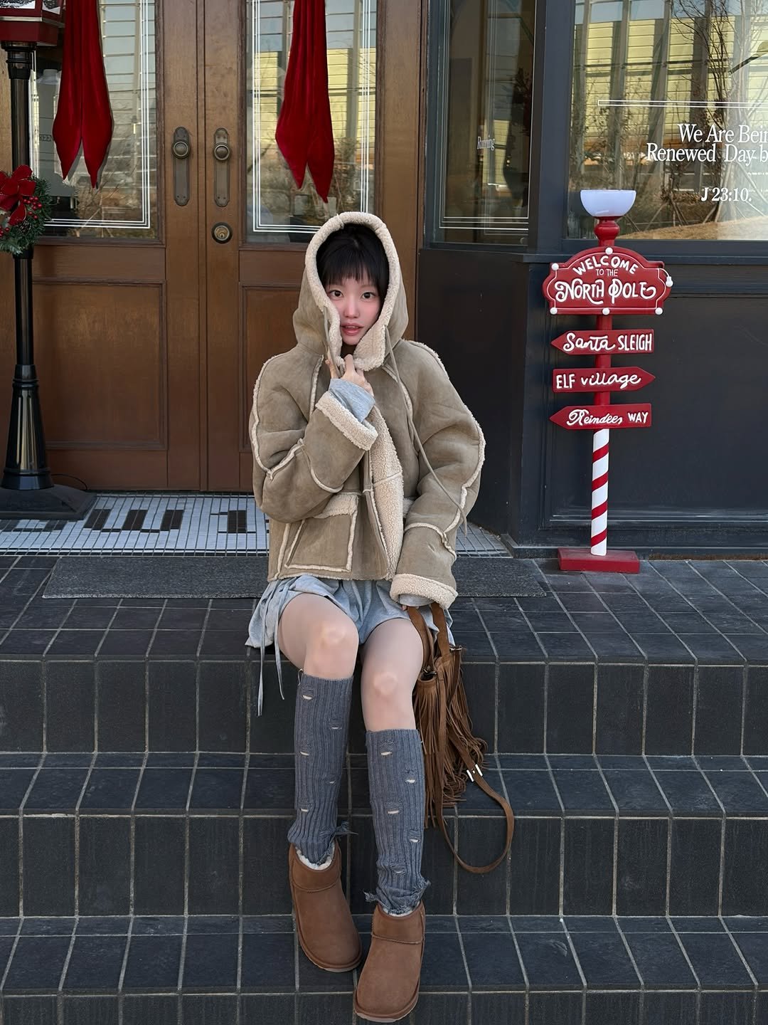 Photo shared by 하여니 on January 22, 2026 tagging @saveheelskr, and @emuaustralia_korea. May be an image of ‎duffle coat, overcoat, fur coat, boots, parka and ‎text that says '‎タ 一 ー ب We Are WeAreBei Beit Renewed Dav J23:10 WELCOME ช POLE SanTaSLEIGH SLEIGH ELF aAe অ WAY‎'‎‎.