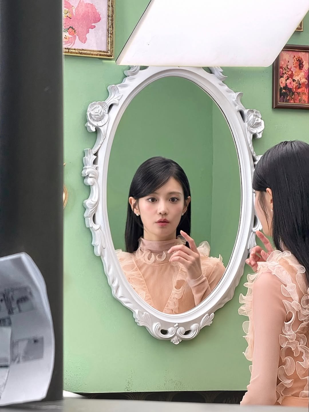 Photo by 우다비 on November 27, 2025. May be an image of one or more people, makeup, mirror, dress and text.