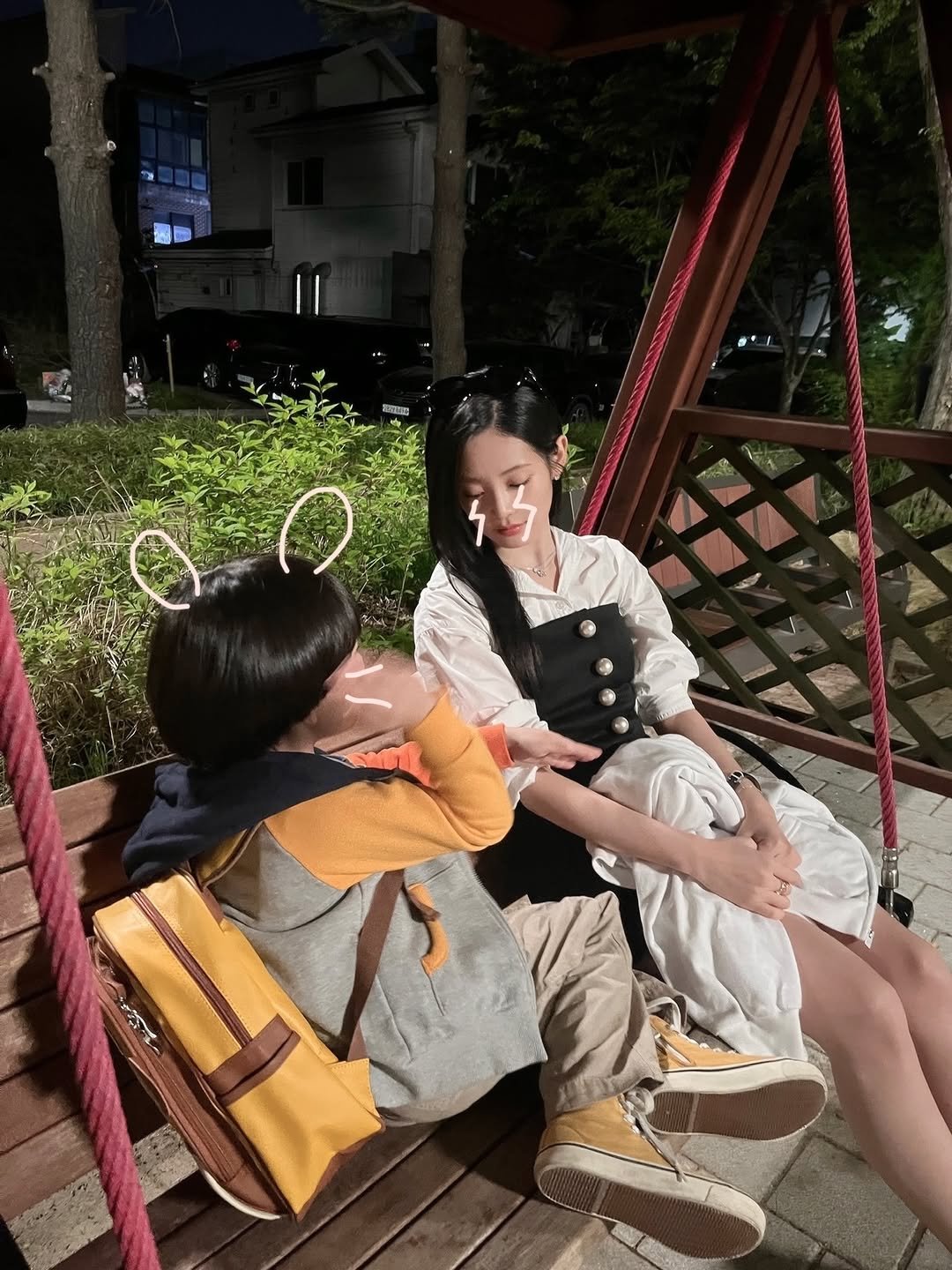 Photo by 우다비 on November 21, 2025. May be an image of one or more people, wind chime, deck chair, chaise lounge, outdoors and text.