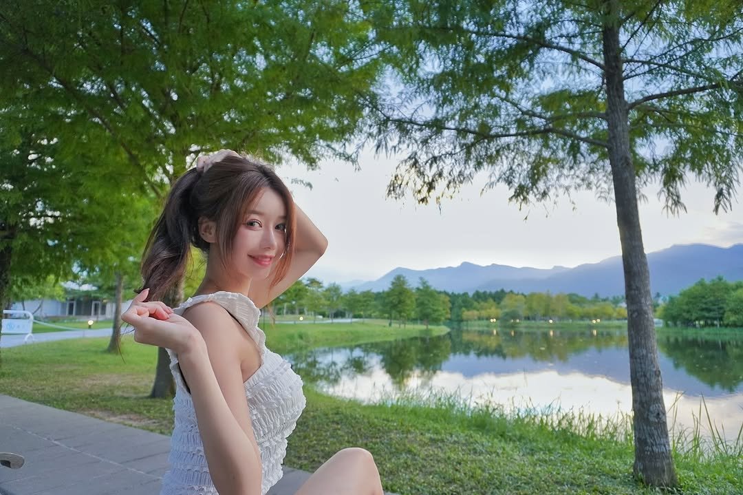 Photo by 이아영 on September 07, 2025. May be an image of 1 person, hair, dress, lake and text.