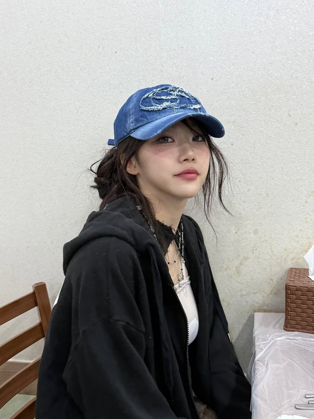 Photo by 지원 JEEWON on June 22, 2025. May be an image of 1 person, hat, parka, top and text.