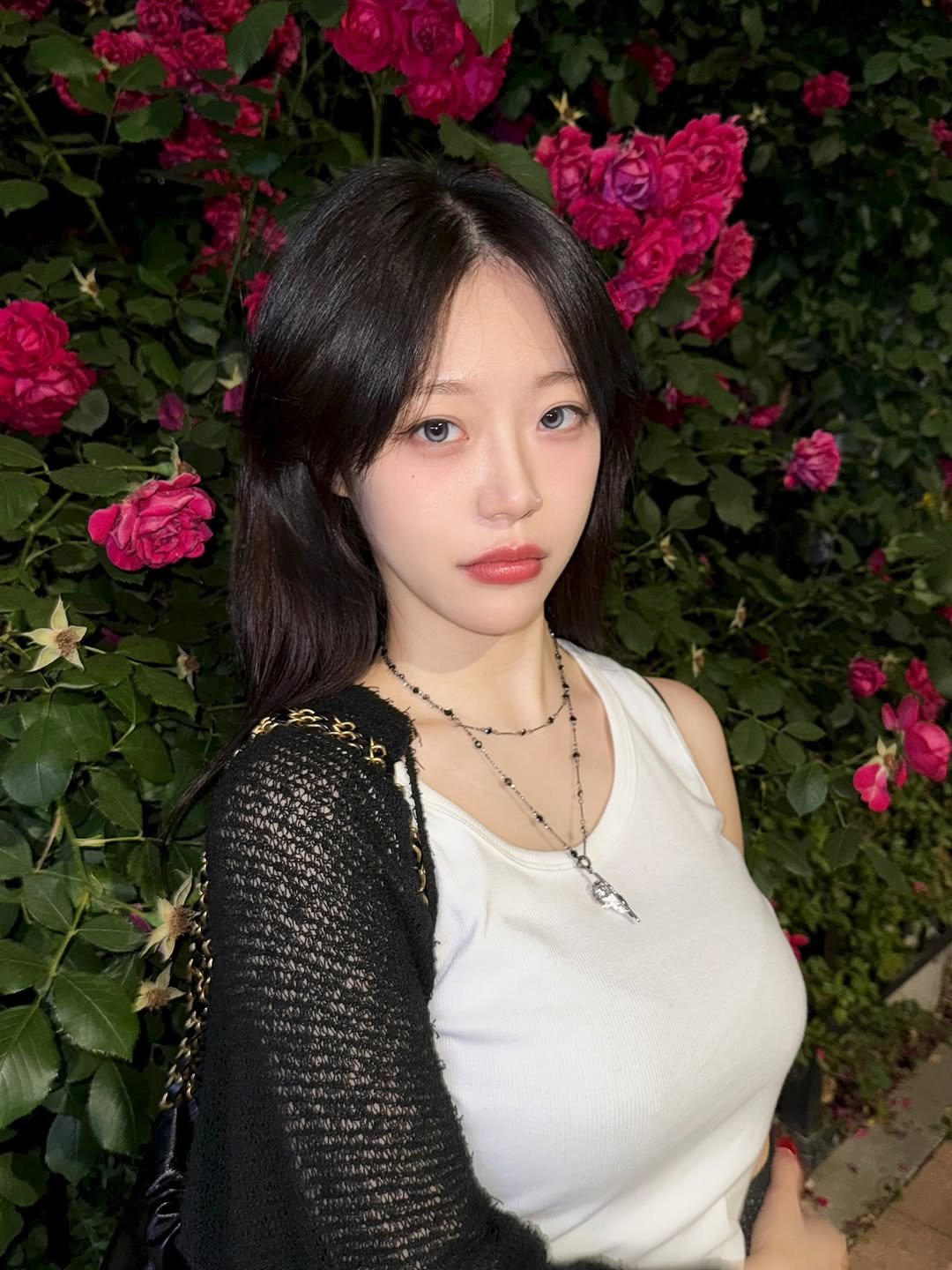Photo by 지원 JEEWON on June 14, 2025. May be an image of one or more people, hair, rose, outdoors and text.