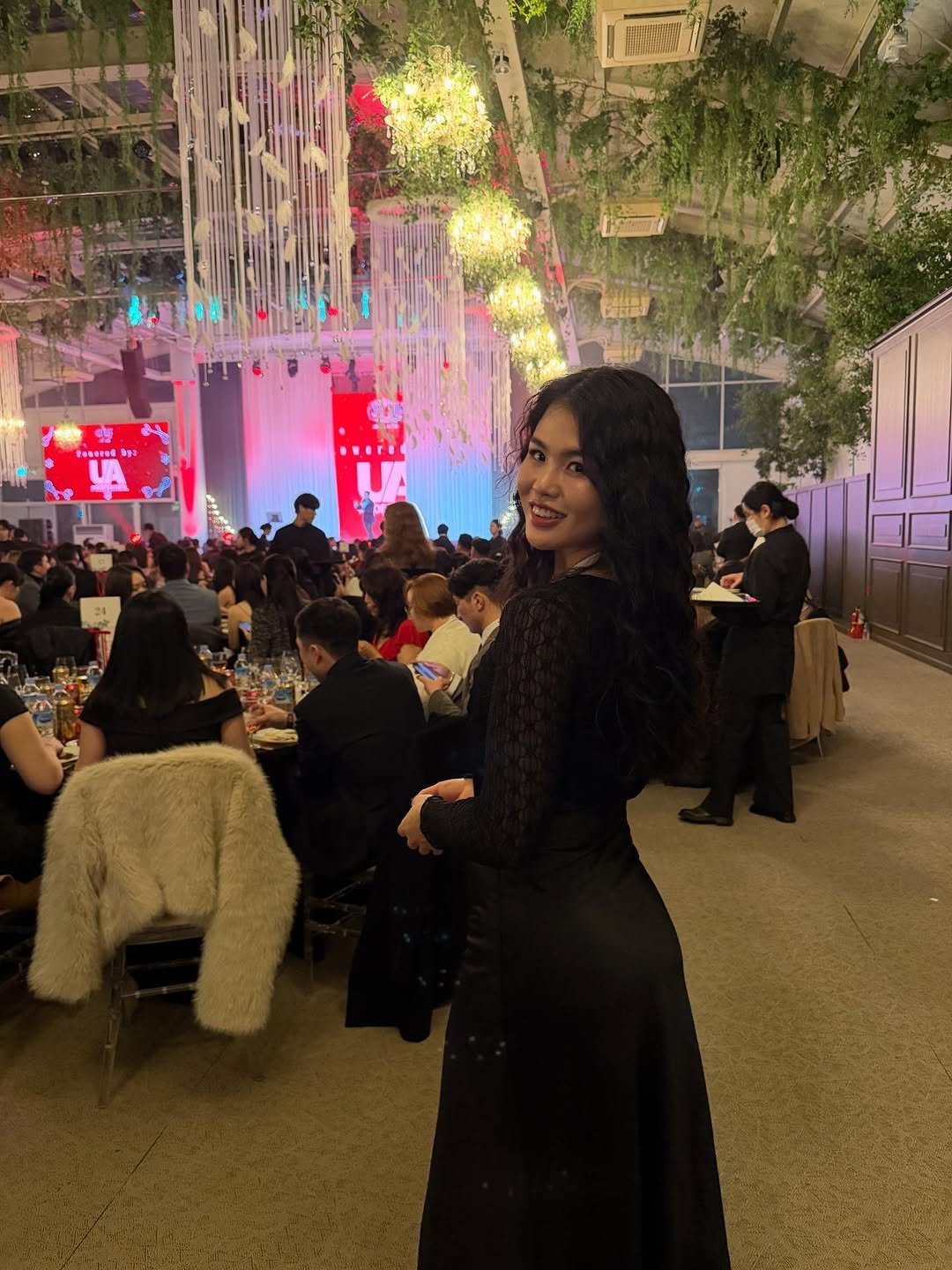 Photo by 지야 on December 30, 2025. May be an image of candle holder, lighting, gown and text.