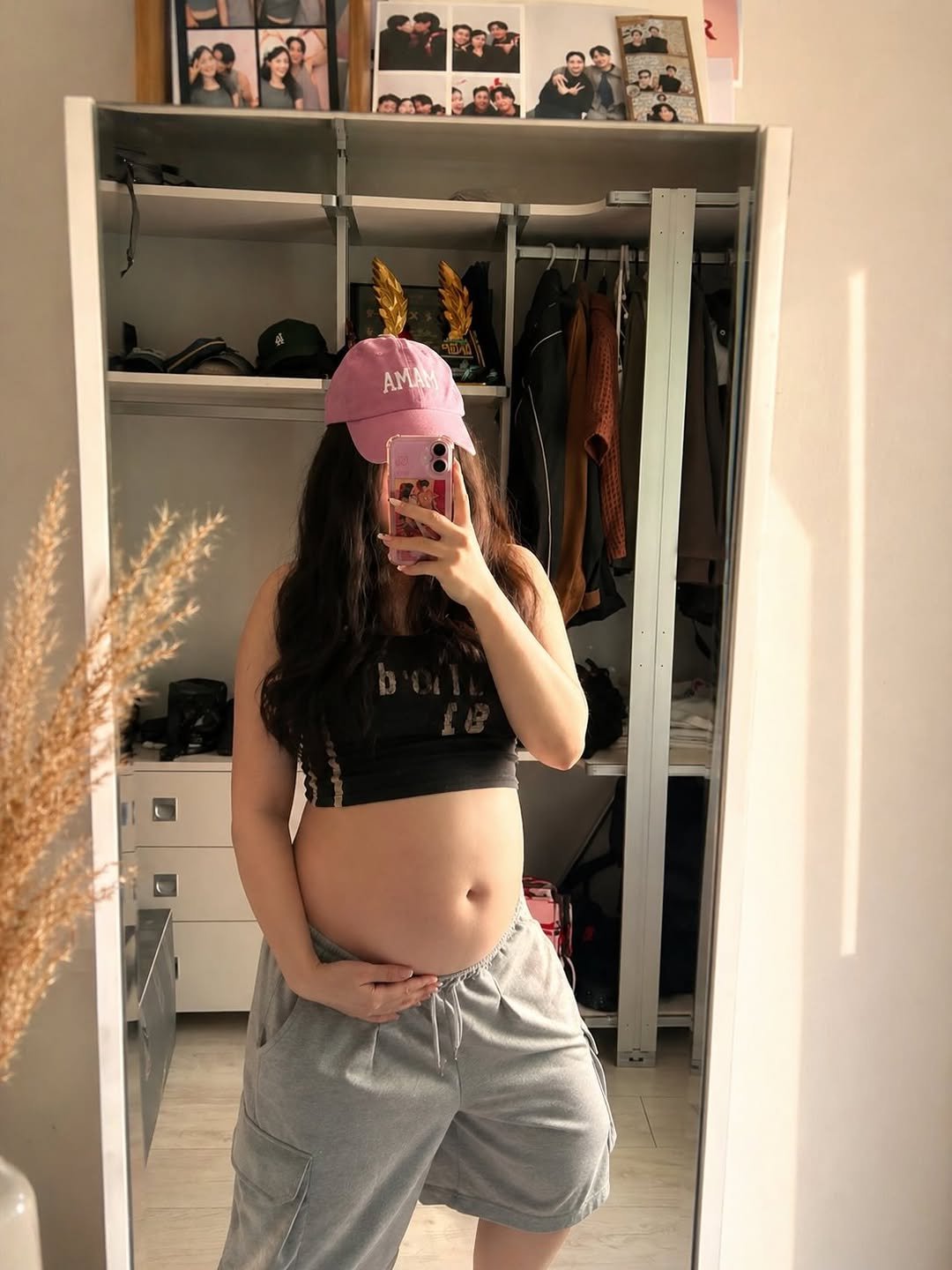 Photo by 지야 on April 26, 2026. May be an image of hat, sweatpants and text.