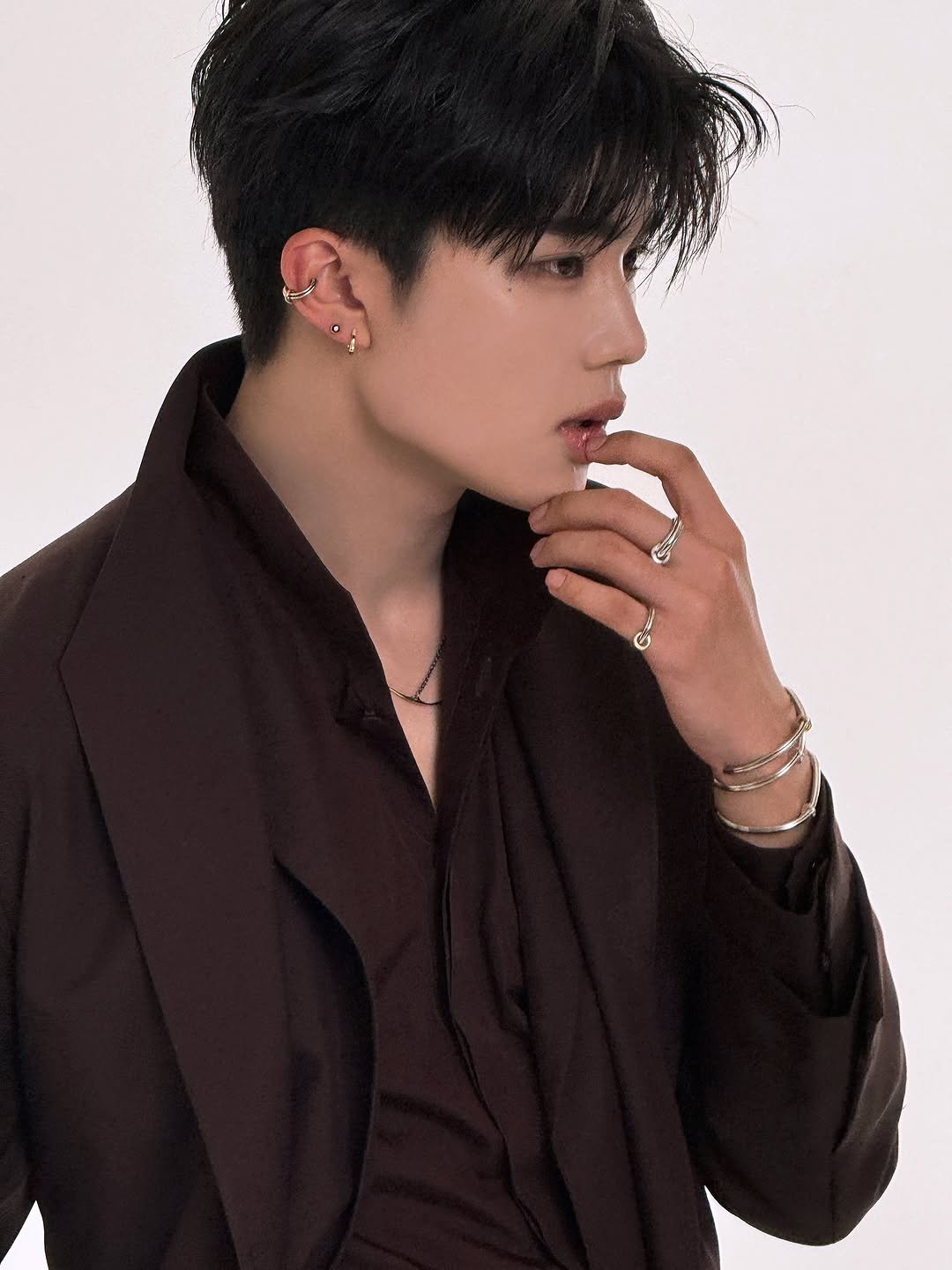 Photo by ZEROBASEONE on December 01, 2025. May be an image of one or more people, hair, bolo tie and text.