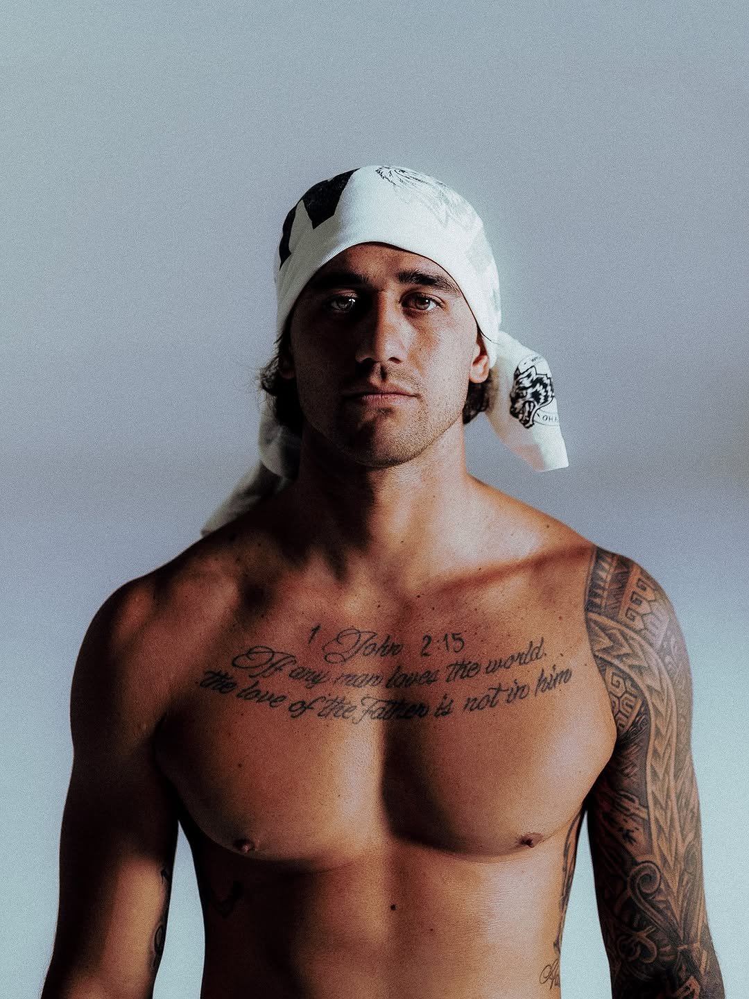 Photo shared by Darc Sport Athletics on October 14, 2025 tagging @zekelau. May be an image of one or more people, beard, biceps, bandanna, underwear, sweat band and text.