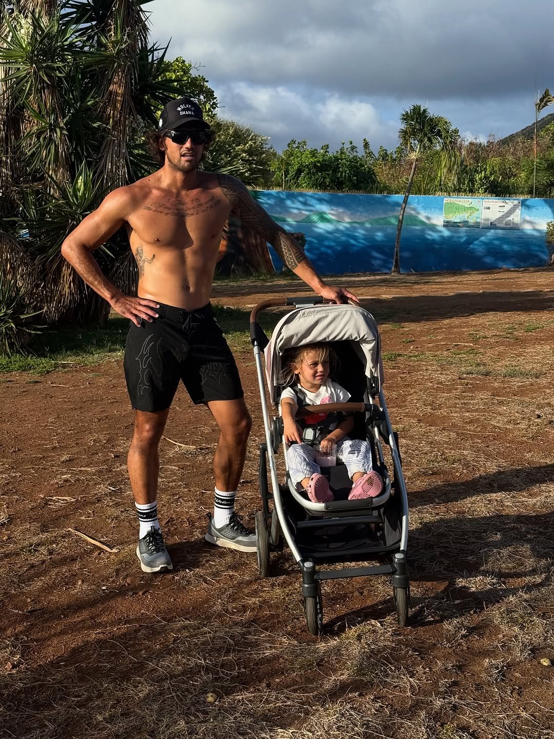 Photo shared by Zeke Lau on September 12, 2025 tagging @olukai, @j.bleu, and @darcsportathletics. May be an image of 2 people, baby, park and text.