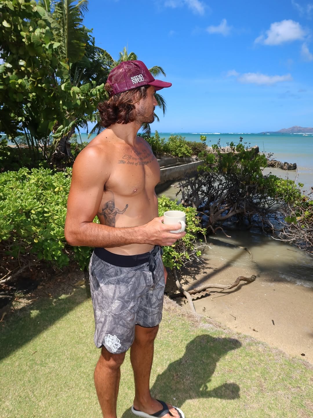 Photo shared by Zeke Lau on August 09, 2025 tagging @lioncoffeehi. May be an image of 1 person, ocean, beach and text.