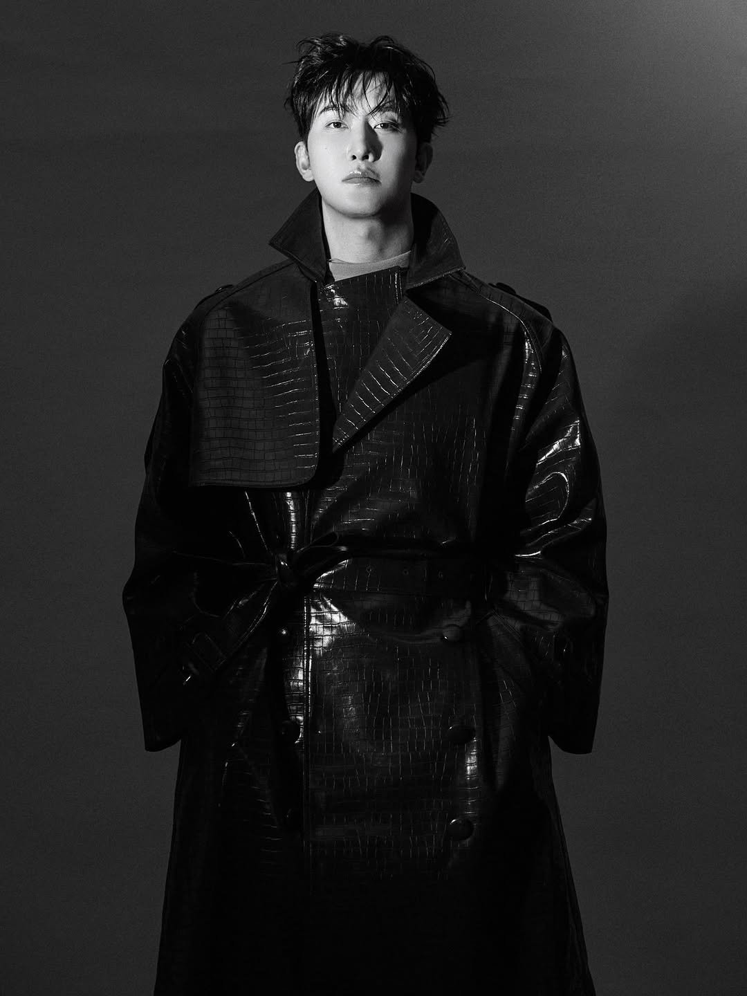 Photo by ZHOUMI 조미 周觅 on January 14, 2026. May be a black-and-white image of one or more people, bangs, makeup, duffle coat, overcoat, raincoat, parka, top, bolo tie and text.