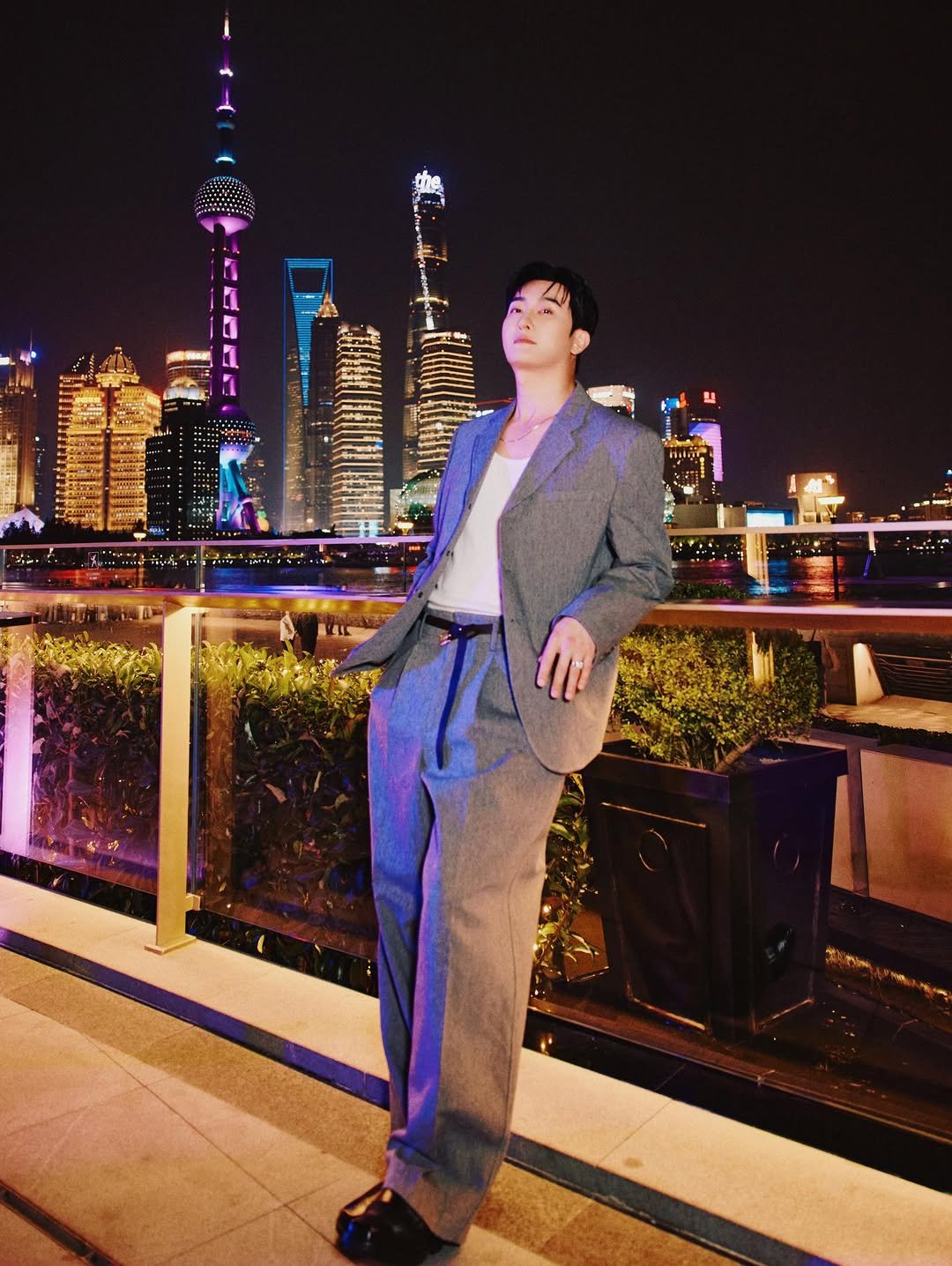 Photo by ZHOUMI 조미 周觅 on December 27, 2025. May be an image of suit, blazer, tower and text.