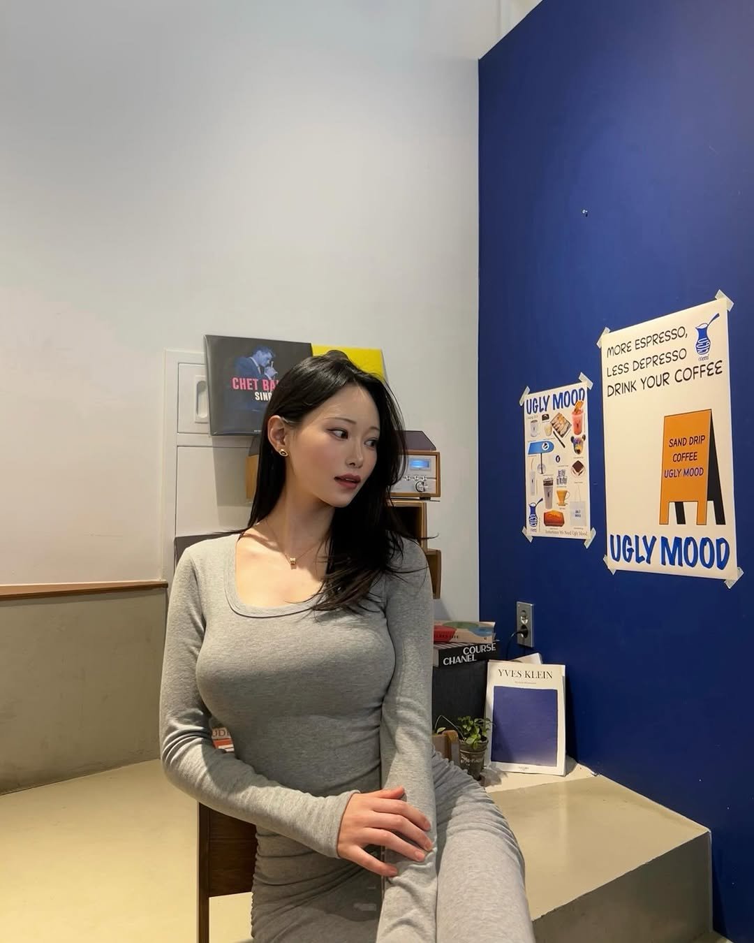 Photo shared by 해나 海娜 Mia on February 01, 2026 tagging @zzxvu. May be an image of ‎one or more people, hair, top, cornflower and ‎text that says '‎CHET SINP MORE ESPRESSO, NOREESPRESSO, ง LESS DEPRESSO COFFEE DRINK YOUR UGLY SAND SANDDRIP DRIP COFFEE LGLY HODD لت UGLY MOOD CHANEL YESKLEIN YVES KLEIN‎'‎‎.