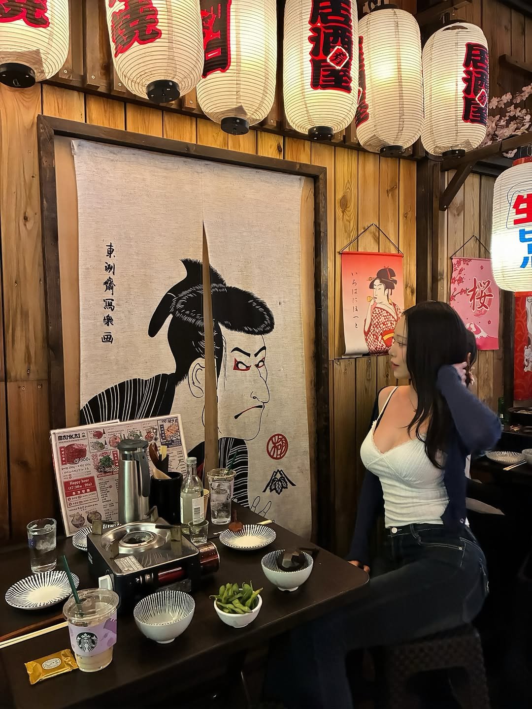 Photo by 해나 海娜 Mia on April 25, 2026. May be an image of sushi, chopsticks, lantern and text.