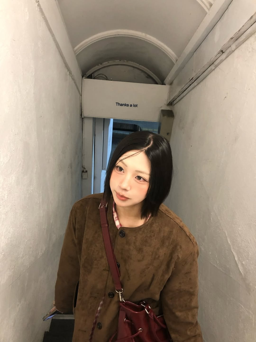 Photo by 지에키 on March 15, 2026. May be an image of one or more people, hair, duffle coat, parka and text.