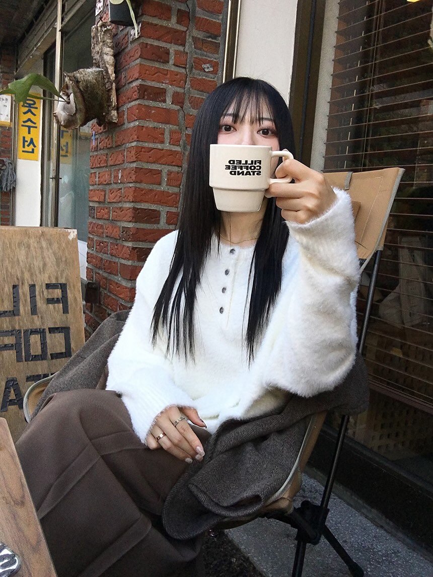 Photo by 지인 on November 03, 2025. May be an image of one or more people, hair, duffle coat, coffee cup, parka, turtleneck, cornflower and text.