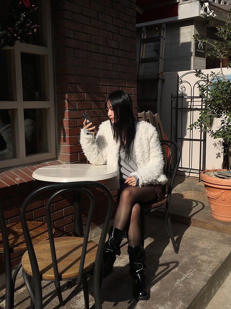 Photo by 지인 on November 25, 2025. May be an image of miniskirt, brick wall and text.