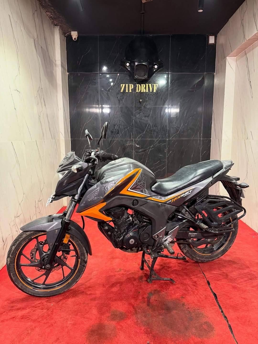 Photo by ZIPDRIVEMUMBAI on November 23, 2025. May be an image of scooter, motorcycle and text that says '7IPDRIVE 7IP DRIVE NO MOO'.