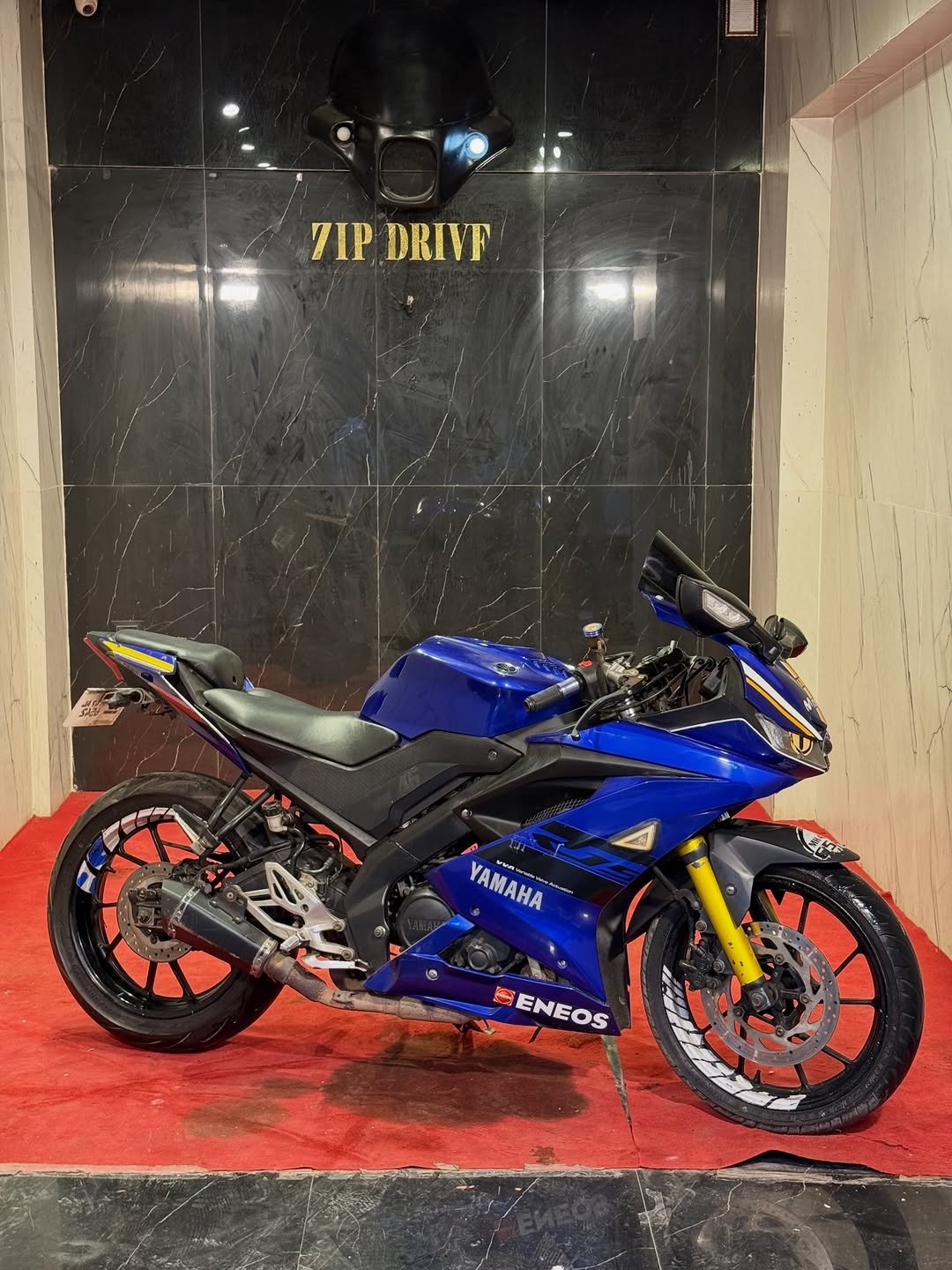 Photo by ZIPDRIVEMUMBAI on April 07, 2026. May be an image of motorcycle, helmet and text that says '7IP DRIVF あり O YAMAHA YAMAHA waveo E ENEOS ENEOS'.