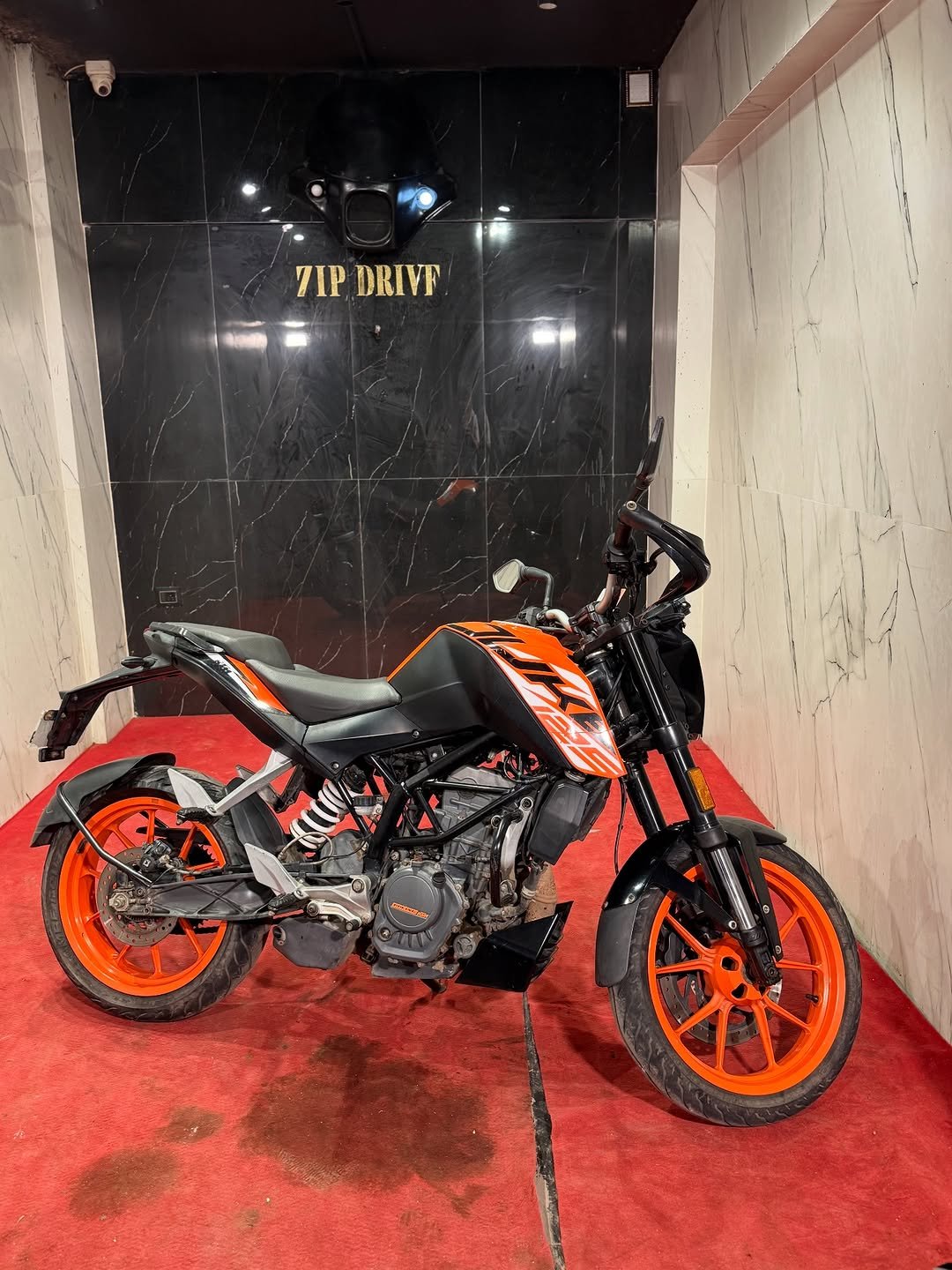 Photo by ZIPDRIVEMUMBAI on December 05, 2025. May be an image of motorcycle, dirt bike, helmet, scooter and text that says '号 TIP 7IP.DRIVF DRIVF'.