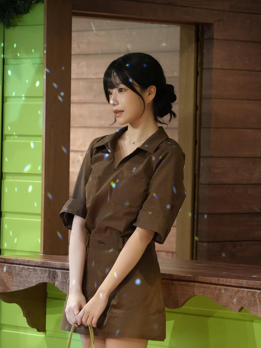 Photo shared by 조유리 JO YURI on November 12, 2025 tagging @longchamp. May be an image of dress, military uniform and text.